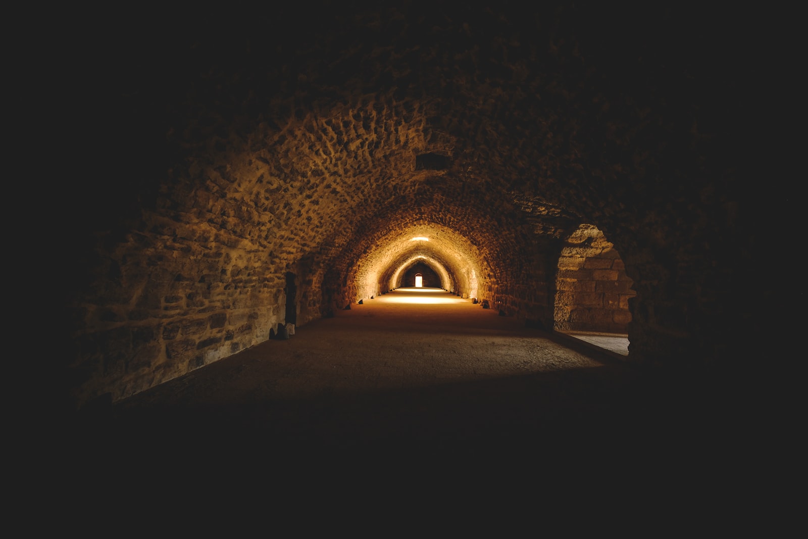 a tunnel with a light at the end of it
